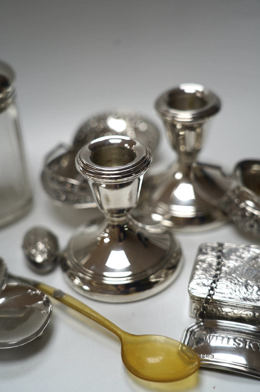 A group of mixed silver including a five bar toastrack, pair of dwarf candlesticks, 19th century snuff box, ring tree dish, cream jug, etc. Condition - poor to fair